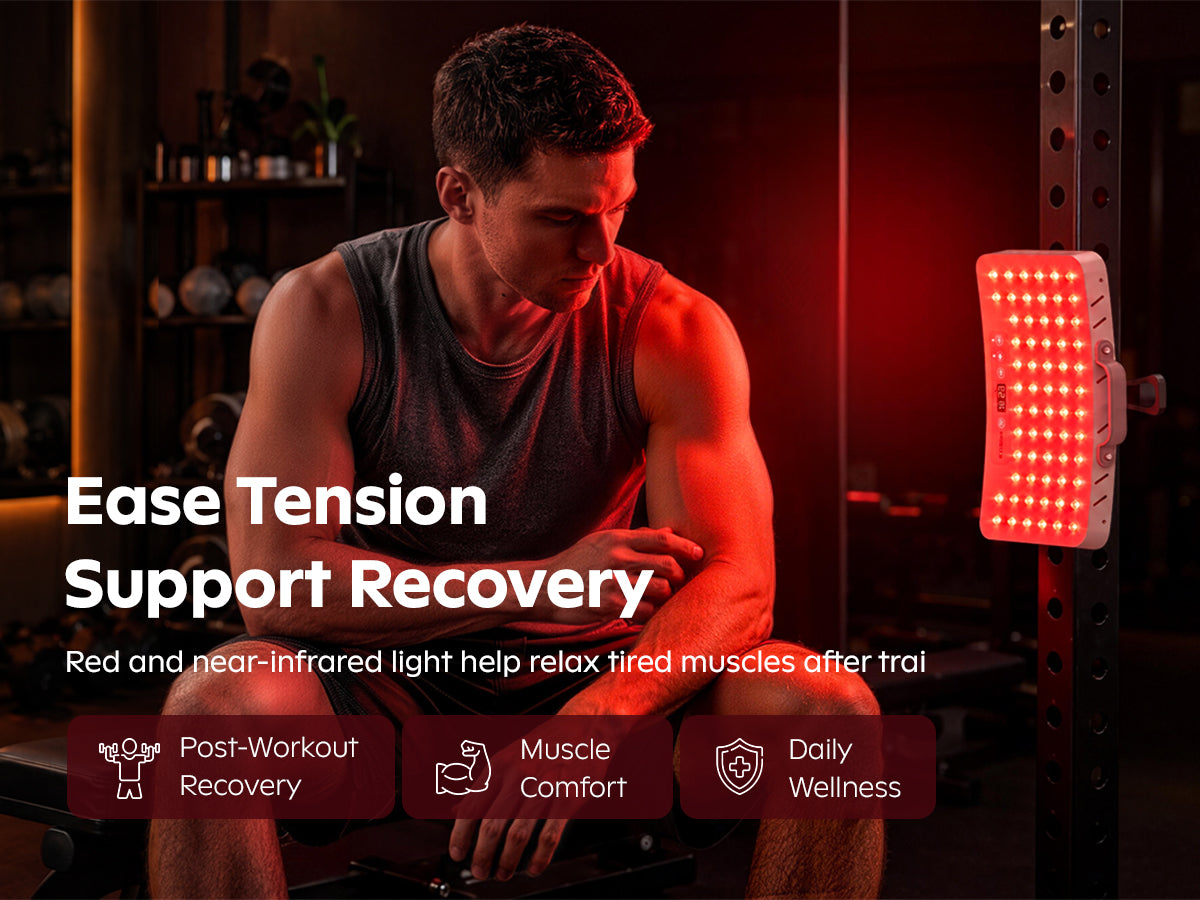 SOLRA portable red light panel on a stand beside a seated man in a home gym